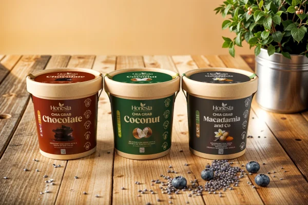 Honesta Essentials Collection – chocolate, coconut and macadamia instant chia seed breakfast pots on a wooden table