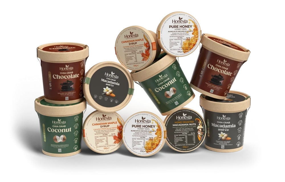 Full Honesta collection of instant chia seed breakfast pots in chocolate, coconut and macadamia with maple syrup, honey and macadamia nut toppings